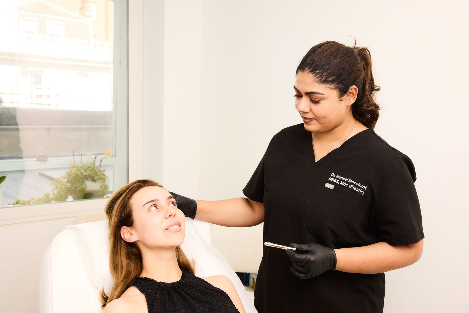 CC6027_BEAUTY 7.pdf-image-016 - Dr Hans Clinics Dr Hans Clinics London | Services | Dr Hansel treating a patient
