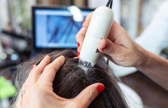 Hair-Scalp2 - Dr Hans Clinics Dr Hans Clinics London | Services | Dr Hansel treating a patient