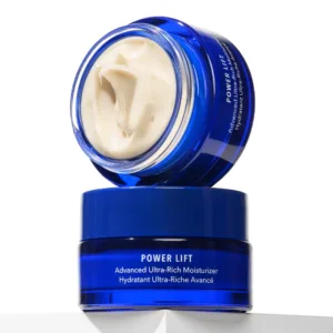 Blue jar of Power Lift Advanced Ultra-Rich Moisturizer opened to reveal cream inside, angled on white surface.